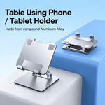 Adjustable height laptop stand for a compatible laptop