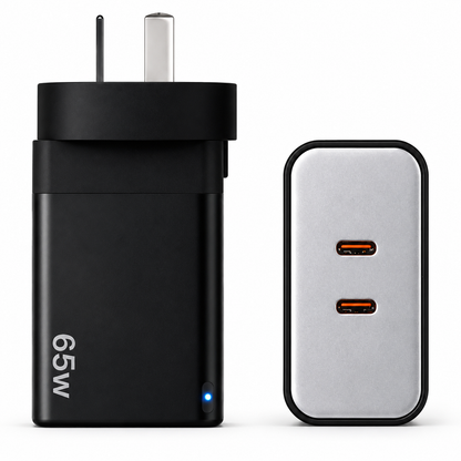 A 65W black wall charger adapter shown next to its silver and black rectangular power brick on a clean white background.