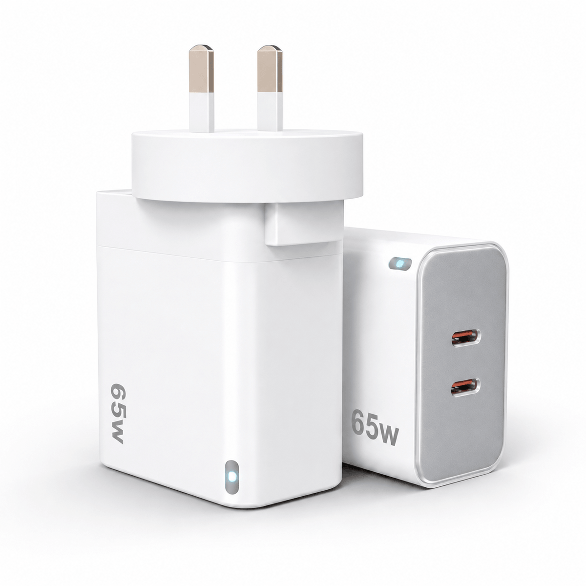A compact white 65W UK wall charger adapter with two flat pins, shown alongside a matching white and gray 65W dual USB-C power block on a clean white background.