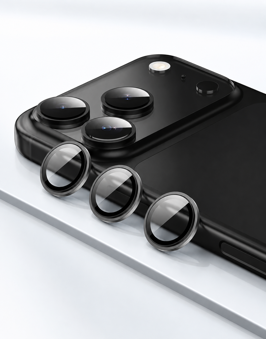 Smartphone with additional camera lens protectors on a white background
