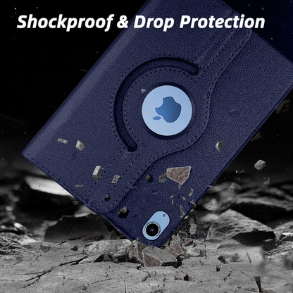 A dark navy blue protective phone case shown at an angle, with a circular cutout revealing a light blue phone insert. The case has a textured leather-like finish and is positioned over a cracked gray surface with debris, under the text 'Shockproof & Drop Protection'.