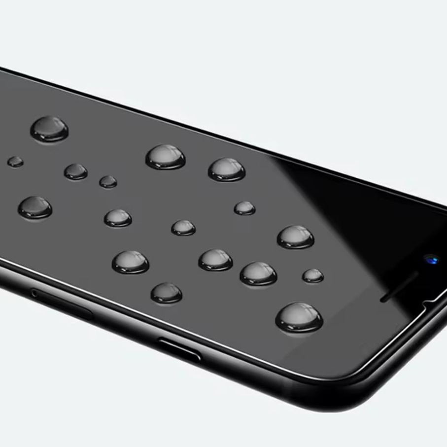 A close-up of a glossy black smartphone screen with water droplets on the surface, shown against a light gray background.