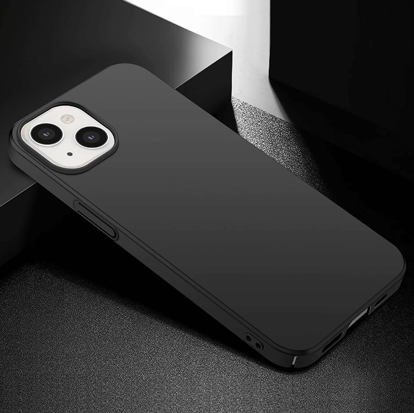 Black phone case on a dark surface with a blurred background