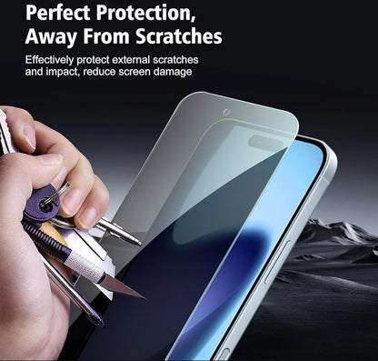 A hand holds a screen protector in front of a smartphone, with marketing text at the top reading 'Perfect Protection, Away From Scratchs' and smaller copy about protecting external scratches and impact. The background is dark with a blurred rocky landscape.