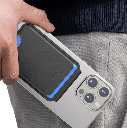 Person holding a phone with a protective case, brand 'Nillkin' visible