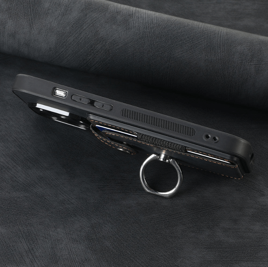 Black phone case with ring holder on a dark textured surface