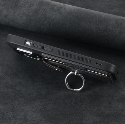 Black phone case with ring holder on a dark textured surface