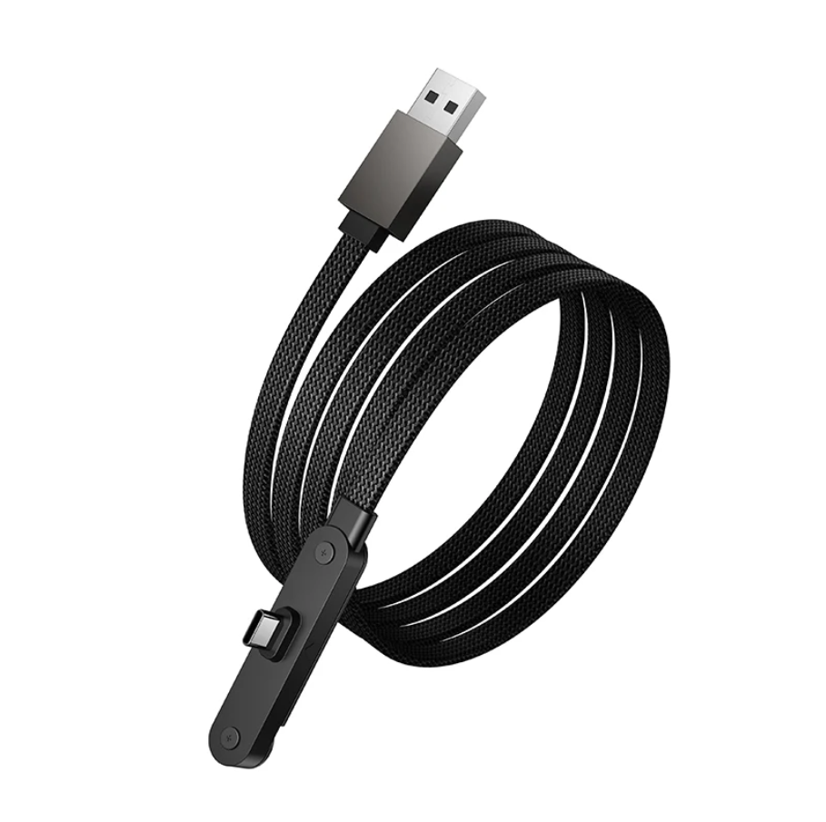 A black braided USB inspection camera cable connected to a smartphone and plugged into a white wall charger on a wooden desk.