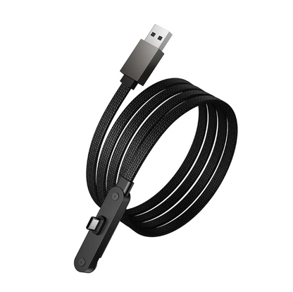 A black braided USB inspection camera cable connected to a smartphone and plugged into a white wall charger on a wooden desk.
