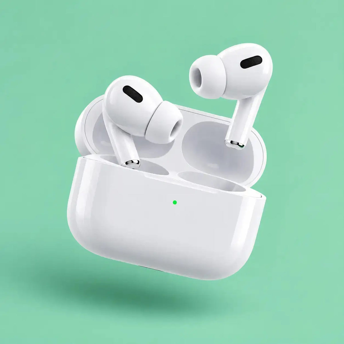 White wireless earbuds floating above an open white charging case on a mint green background.