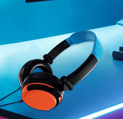 Black and orange headphones on a blue gradient background